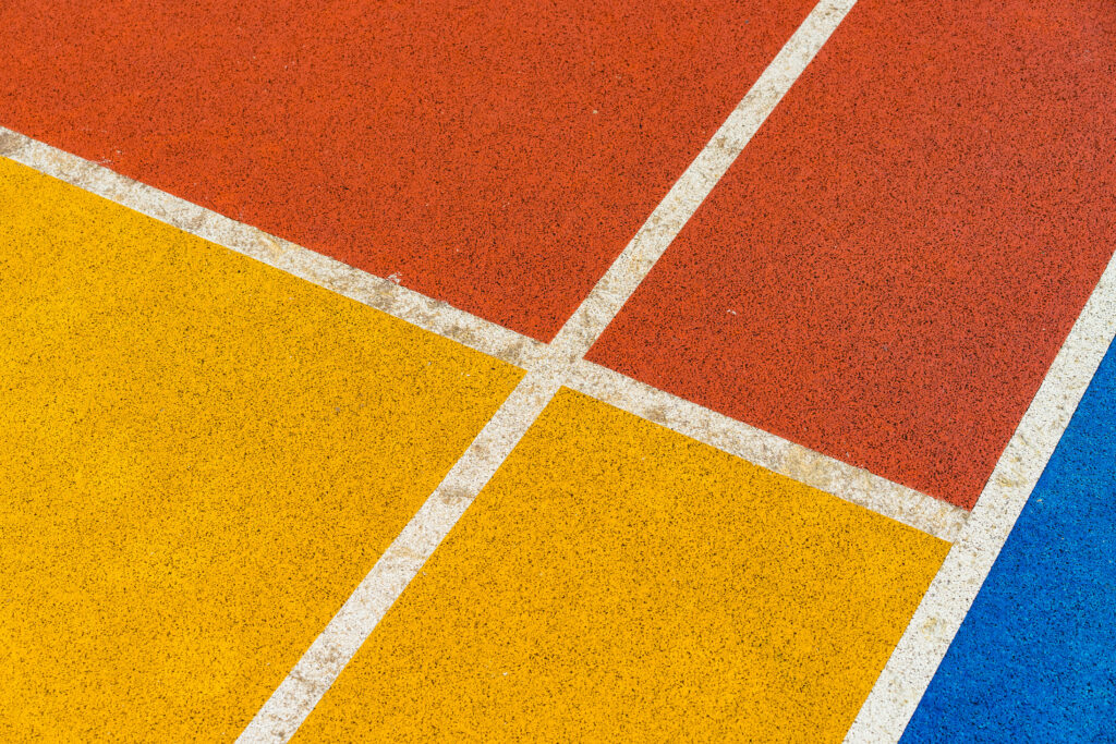 Vibrant Colorful Court Floor Wallpaper: Yellow with Red, Blue, White Lines