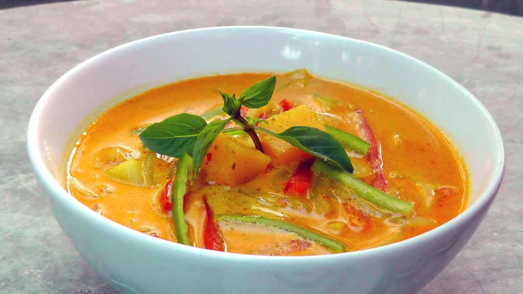 Delicious Asian Cuisine Wallpaper: Vibrant Yellow Curry Delight