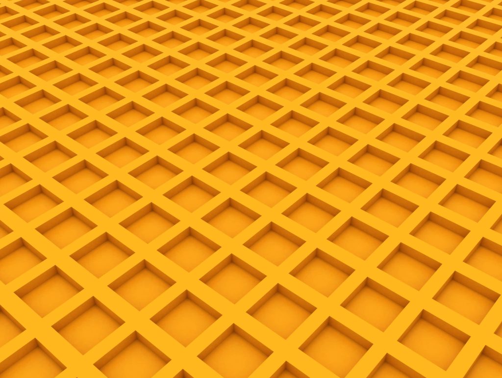 Vibrant yellow 3D grid pattern wallpaper with geometric square indentations in angled perspective