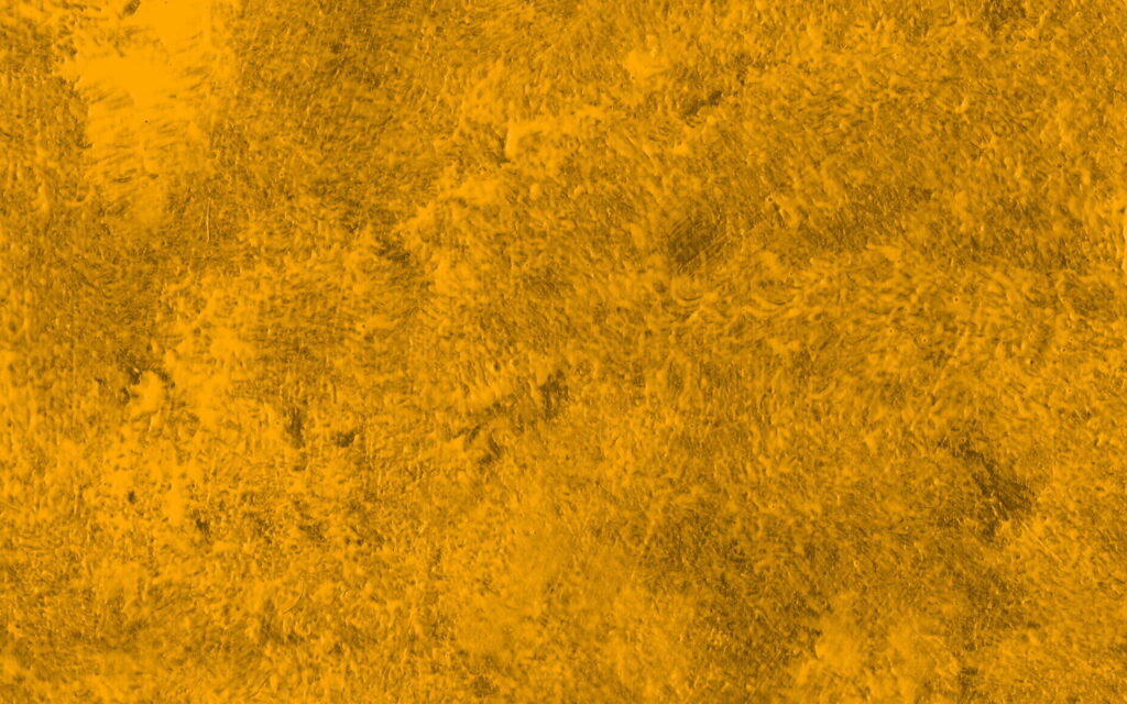 Golden Fusion: A Vibrant Abstract Wallpaper of Textured Yellow Paint and Stone Grunge