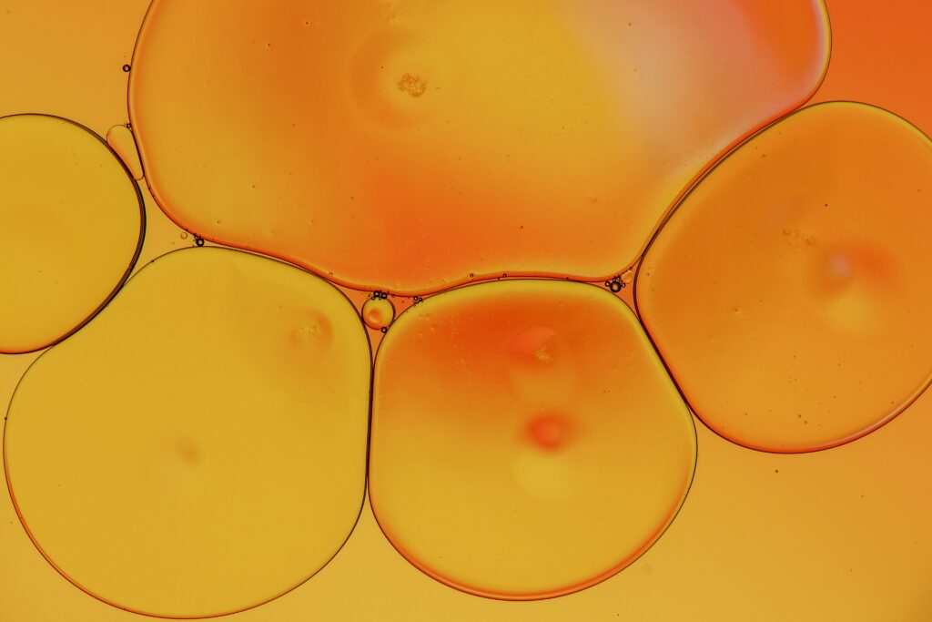 Vibrant Yellow Liquid Bubbles: Abstract Artistic Wallpaper Background