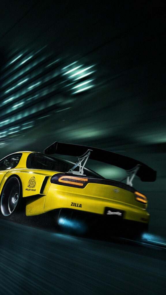 Yellow sports car speeding on dimly lit street at night dynamic racing wallpaper background
