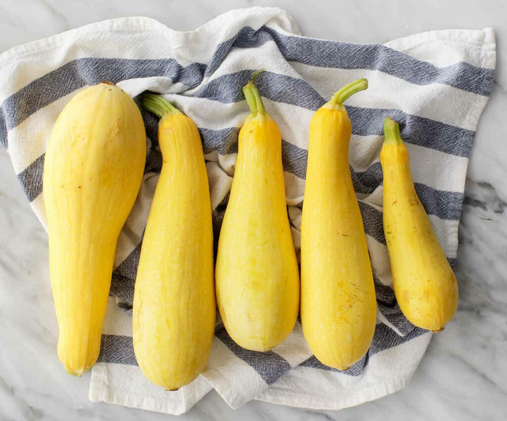 Fresh Yellow Squash Wallpaper: Vibrant Design on Striped Cloth