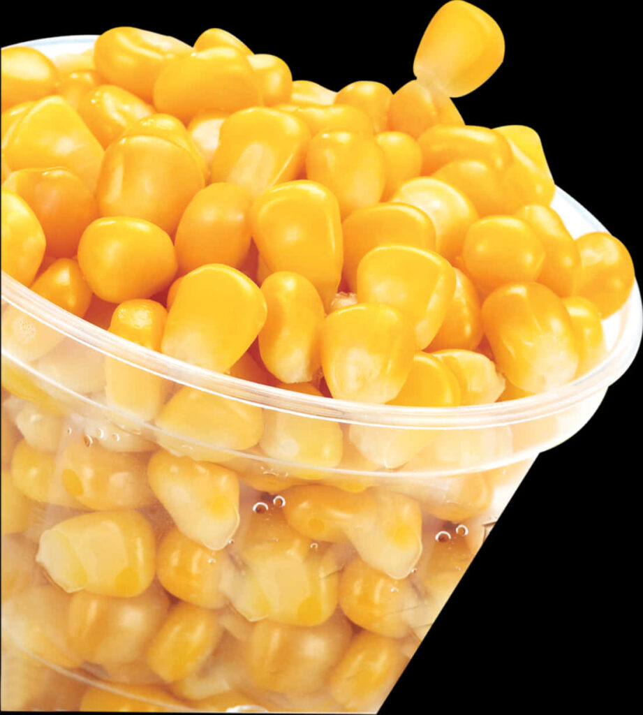 Vibrant Yellow Sweet Corn Kernels in Clear Container - Wallpaper Background