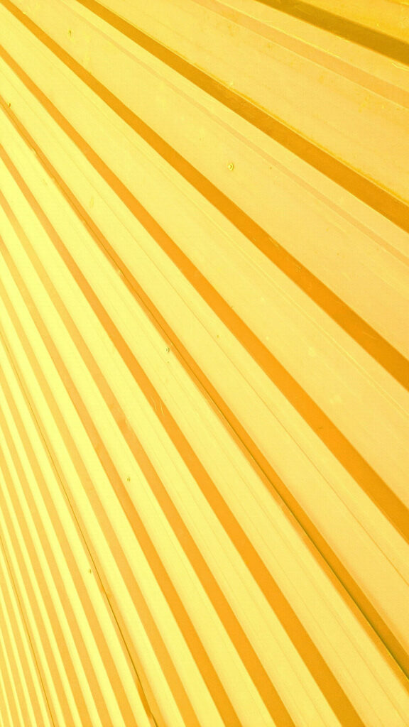Phone-Friendly Textured Surface: Delightfully Vibrant Yellow Background Wallpaper