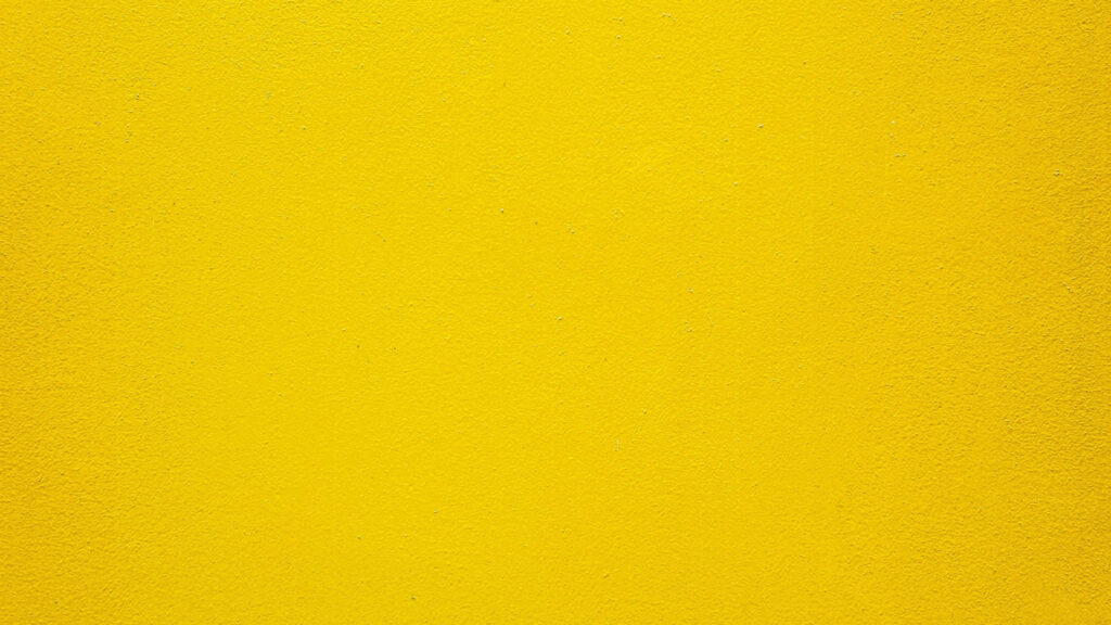Vibrant Yellow Textured Wallpaper: Warm & Energetic Design