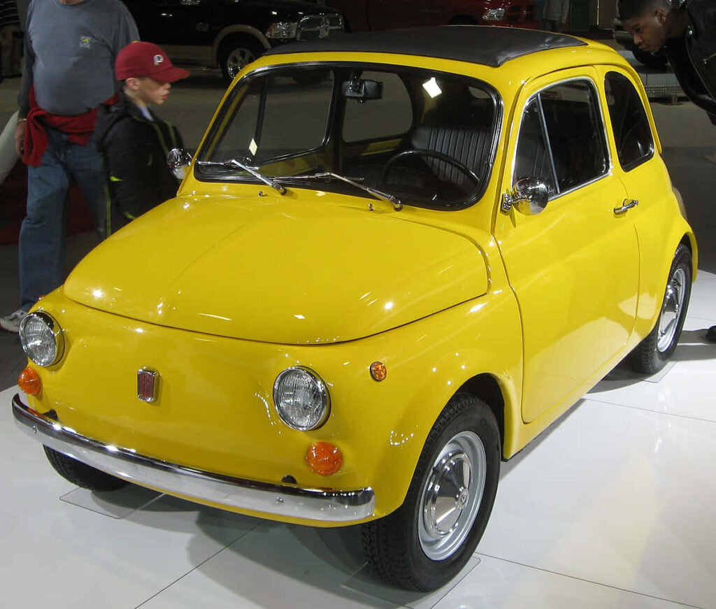 Vibrant Yellow Vintage Fiat 500: Retro Chic Wallpaper for Car Lovers