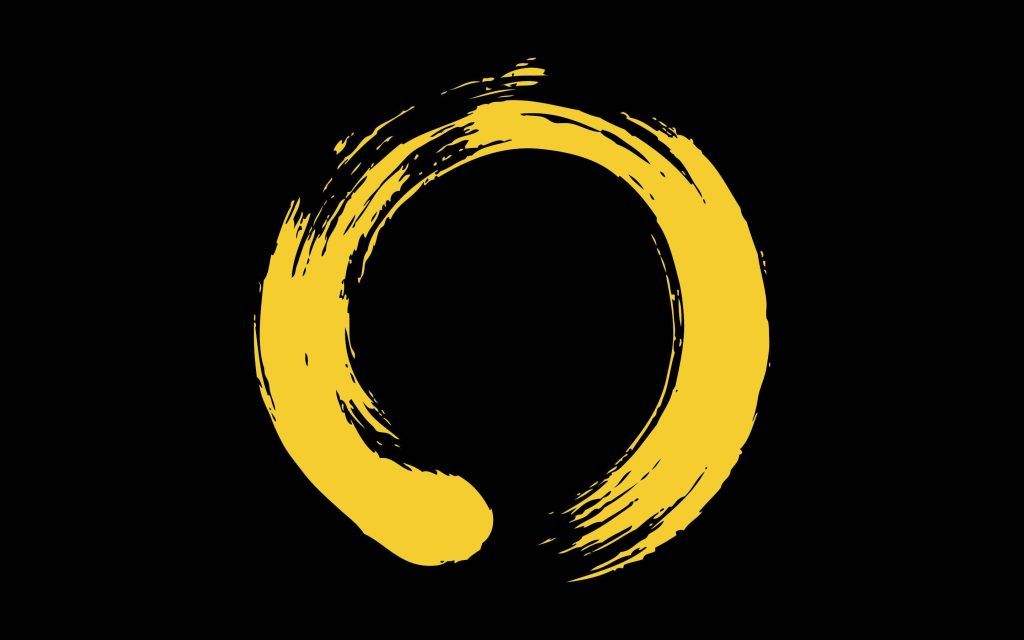 Vibrant yellow Zen enso circle brushstroke on black minimalist artistic wallpaper background
