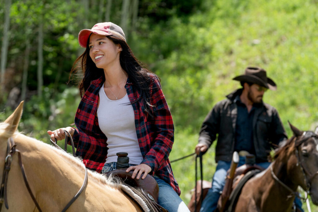 Adventure Scene Wallpaper: Monica & Rip from Yellowstone in Nature