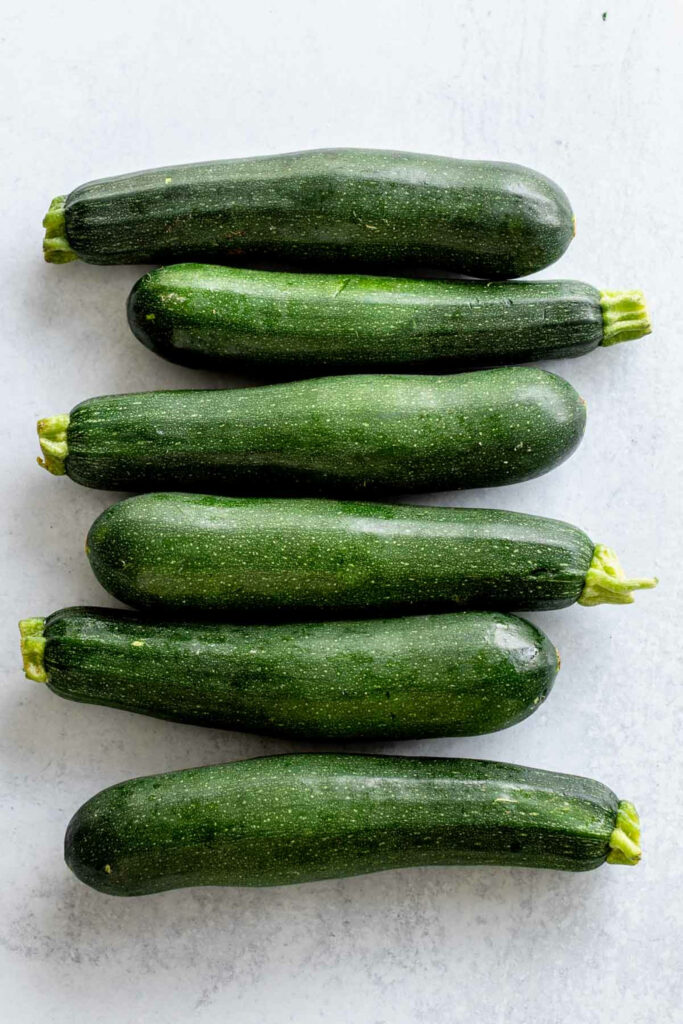 Vibrant Zucchini Wallpaper: Fresh Summer Squash on Gray Background