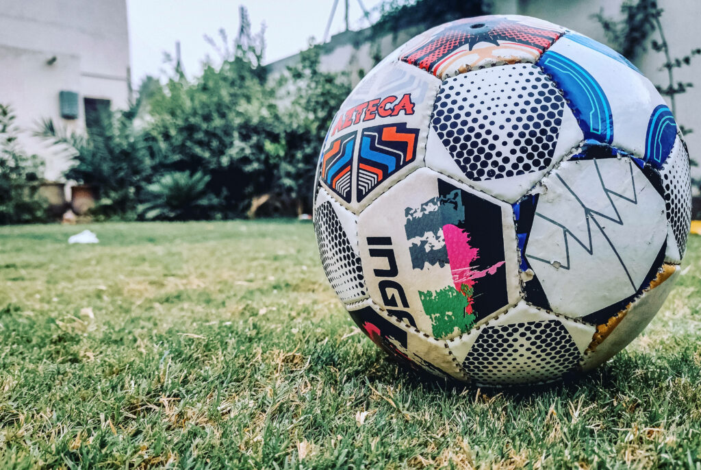 The Vibrant Duality of Football: A Captivating HD Backyard Wallpaper Unveiling a Striking Football Design