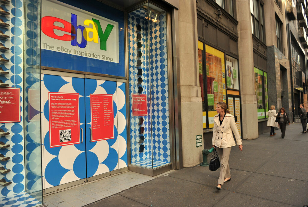 Vibrant eBay Inspiration Shop entrance with blue white geometric patterns and colorful logo Wallpaper