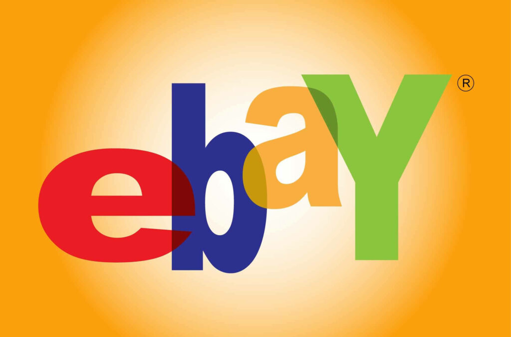 Vibrant eBay logo wallpaper with bold red blue yellow green letters on orange gradient background