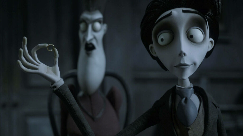 Victor Van Dort from Corpse Bride holding golden ring in gothic stop motion style wallpaper