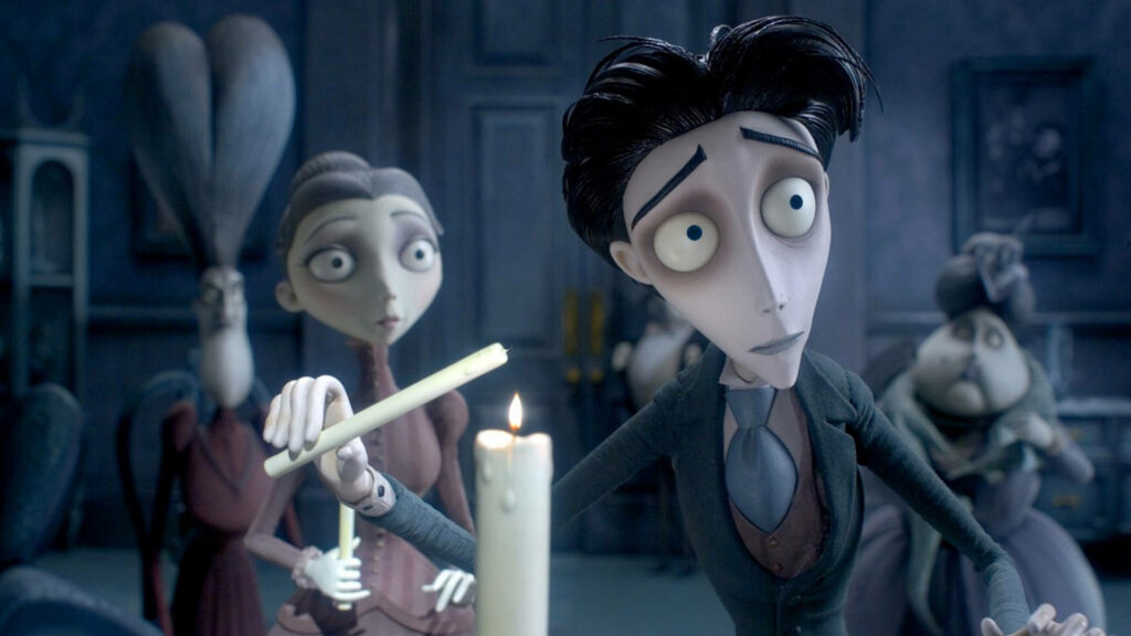Victor Van Dort lighting a candle beside Victoria Everglot in gothic Corpse Bride wallpaper background