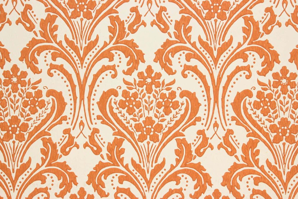 Victorian wallpaper with burnt orange floral damask pattern on creamy off-white background