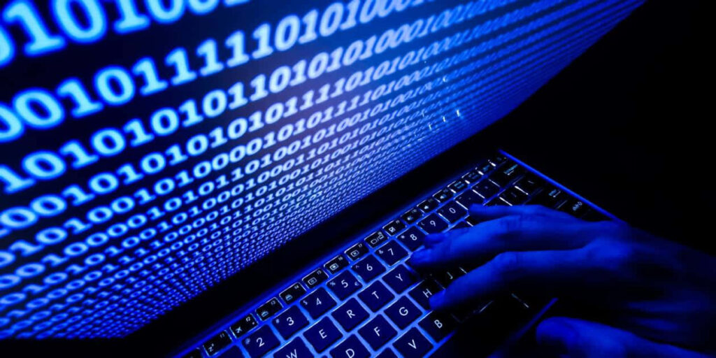 Glowing Blue Binary Code Wallpaper: Cybersecurity Vigilance Background