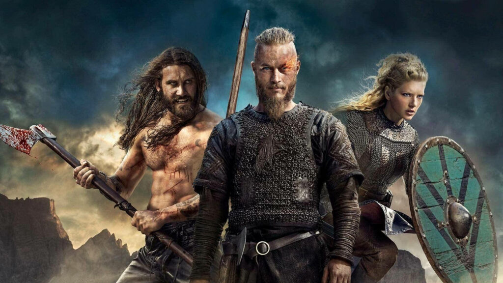 The Ultimate Viking Trio: Ragnar, Rollo, and Lagertha in Battle-Ready Pose Wallpaper