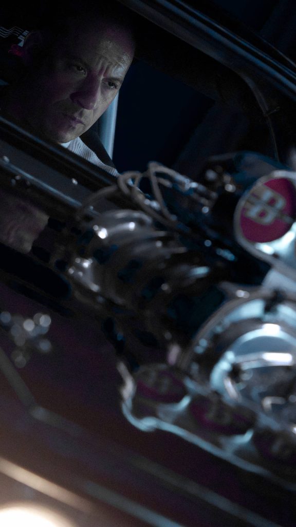 Vin Diesel as Dominic Toretto driving muscle car with chrome supercharger Fast and Furious wallpaper