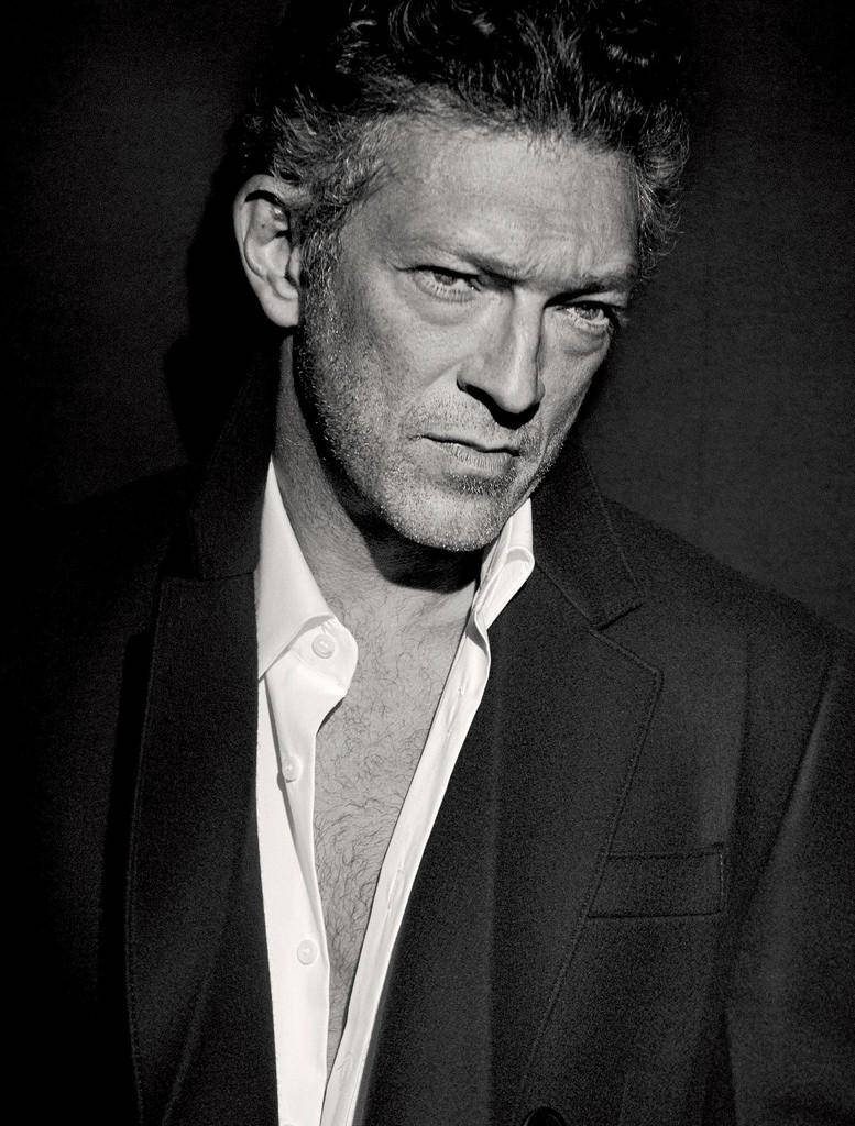 Vincent Cassel intense greyscale portrait dark blazer dramatic lighting professional photoshoot Wallpaper