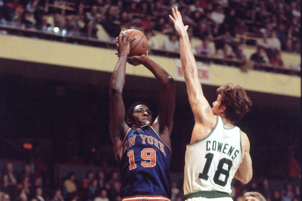 Willis Reed shoots over Dave Cowens in vintage 1970s Knicks Celtics basketball game wallpaper