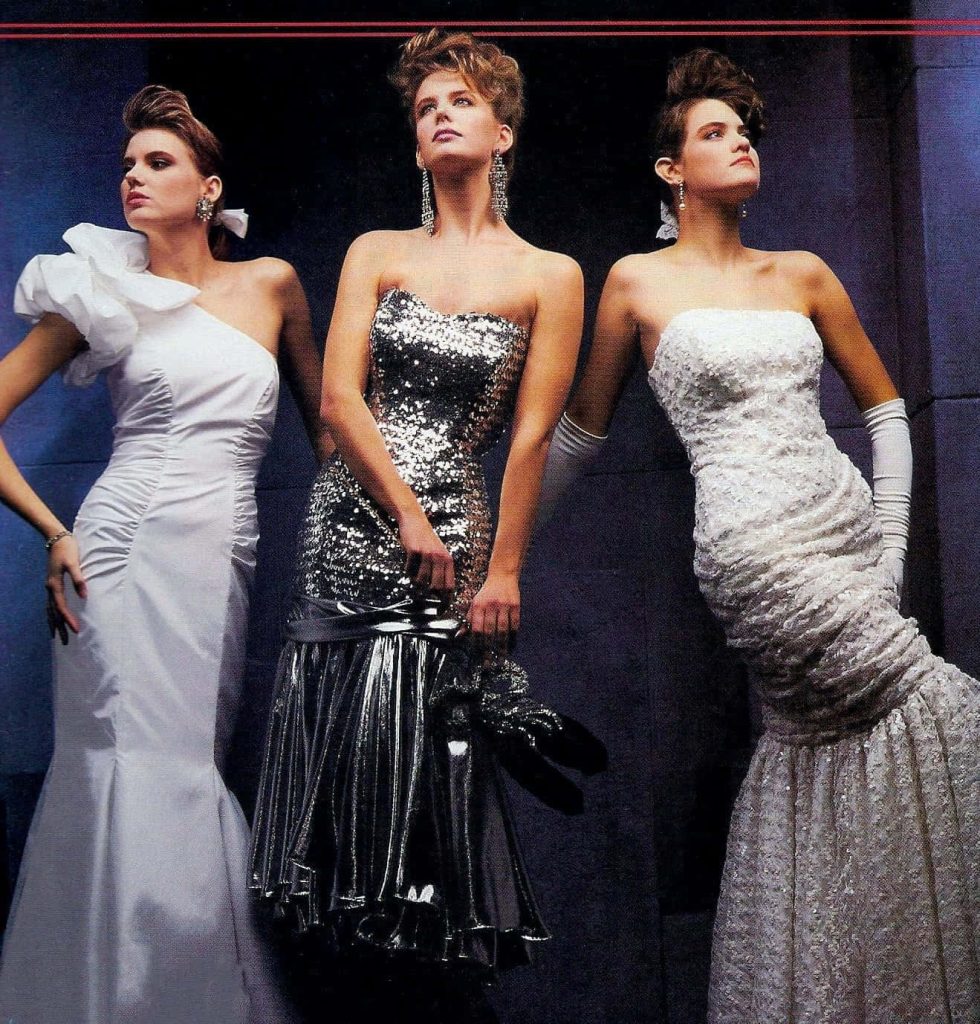 Vintage 80s prom fashion photoshoot with models in sequined gowns ruffles and opera gloves Wallpaper