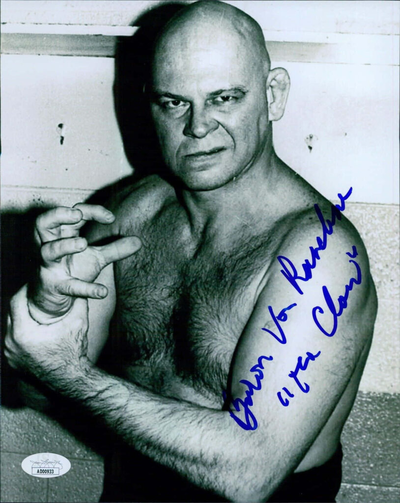 Vintage wallpaper of wrestler Baron Von Raschke in classic stance with signature visible