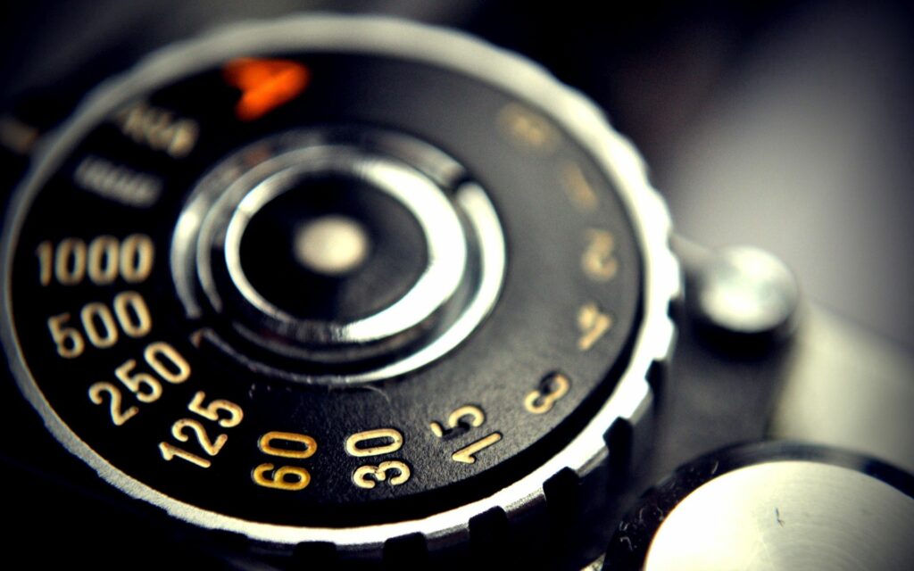 Vintage Camera Dial Close-Up: Nostalgic Photography Wallpaper
