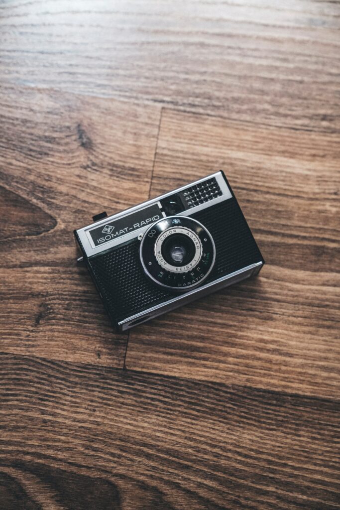 Vintage Camera Wallpaper: Rustic Charm on Textured Wood Background