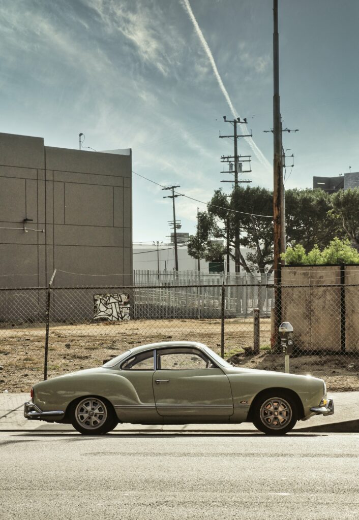 Vintage Car Wallpaper: Retro Vehicle on a Quiet Urban Street
