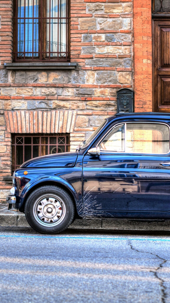 Vintage Car Wallpaper: Timeless Nostalgia with Rustic Background