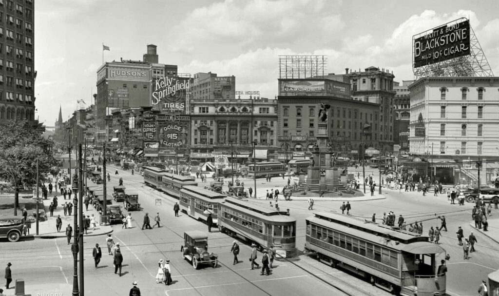 Vintage City Square Wallpaper: Nostalgic Trams, Cars, and Charm