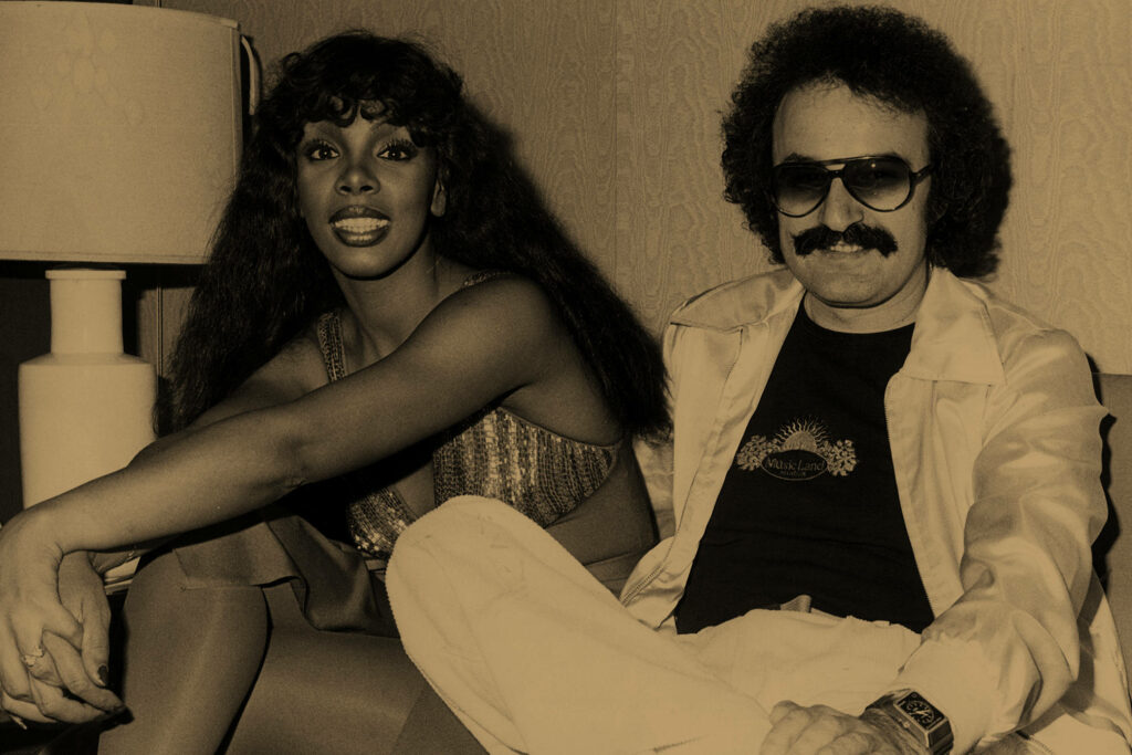 Vintage disco wallpaper with Donna Summer and Giorgio Moroder in 1970s style sepia room
