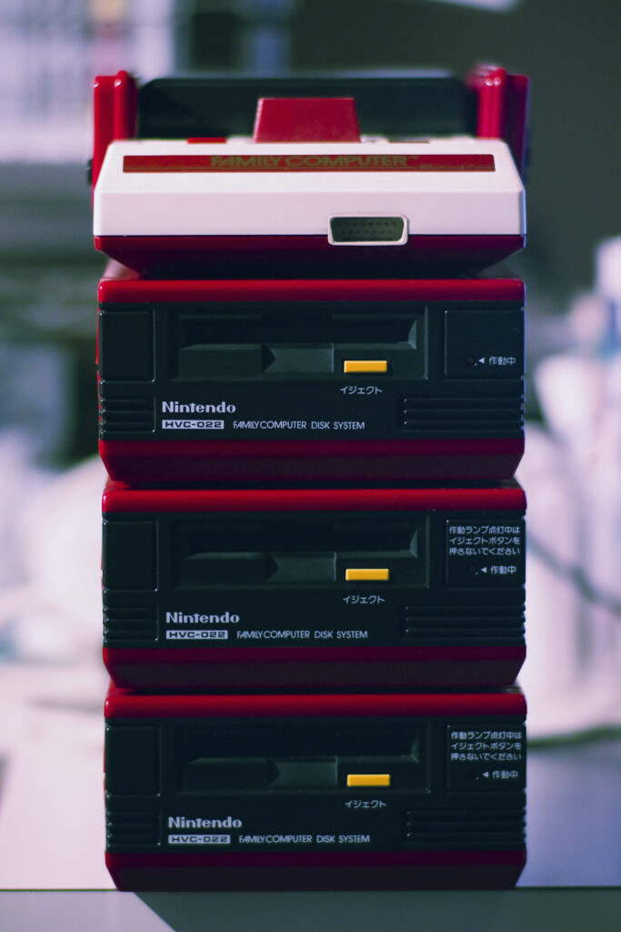Vibrant Vintage Electronics Wallpaper: Retro Nintendo Famicom Aesthetic