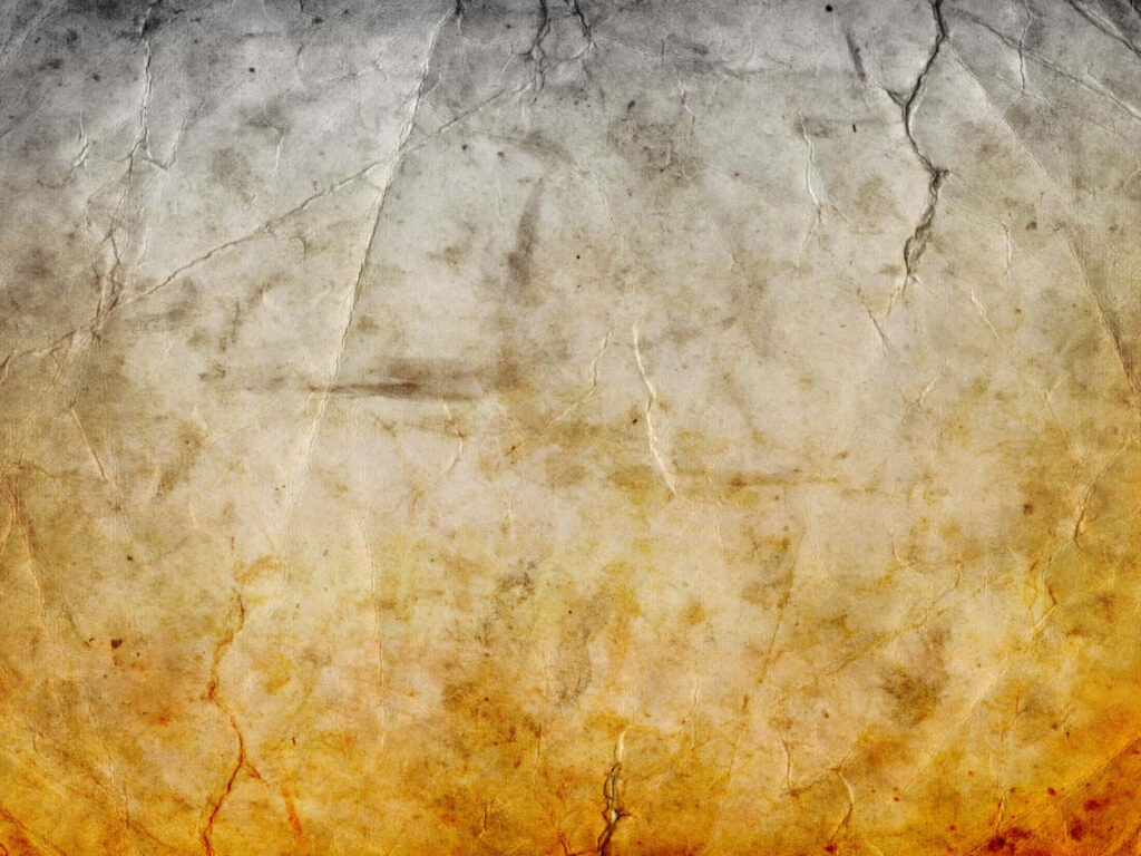 Vintage Vignette: A Captivating Parchment Canvas Unfolding with Torn Elegance Wallpaper