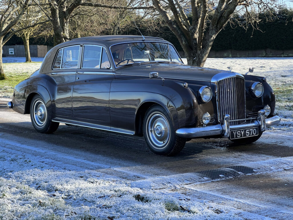 Vintage Bentley S2 Steals the Spotlight Against a Captivating Background Wallpaper