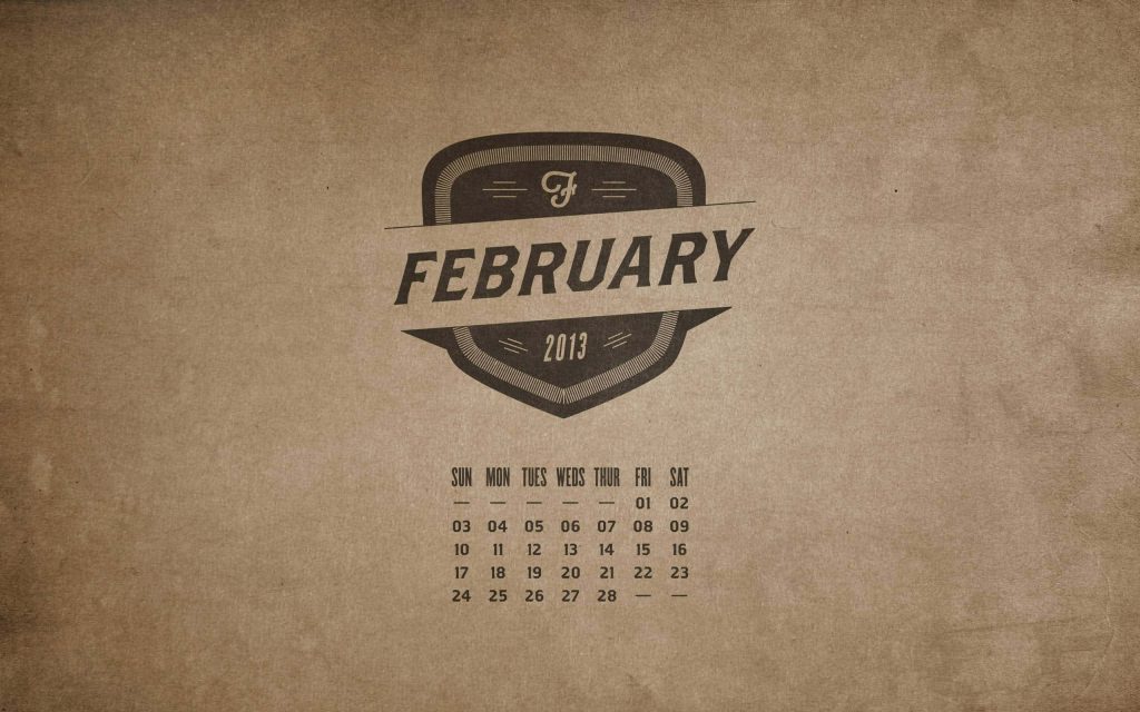Vintage February 2013 calendar wallpaper with minimalist black emblem on sepia paper texture