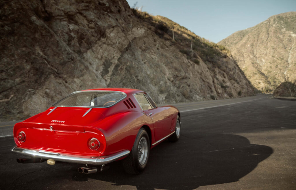 Revive the Thrills: Embark on a Journey Through Time with a Vintage Ferrari Wallpaper
