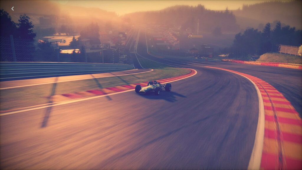 Vintage Formula 1 car racing on scenic sunset track with warm glowing light and dynamic motion Wallpaper