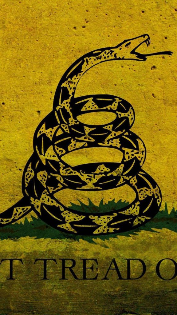 Gadsden Flag wallpaper with coiled rattlesnake on vintage distressed yellow background design