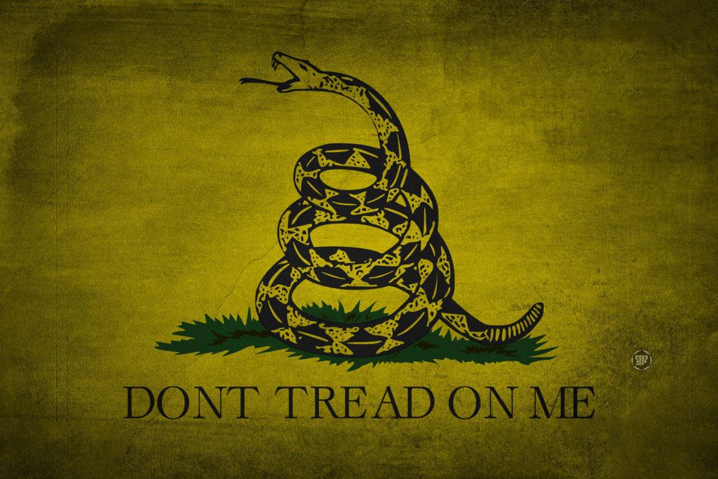 Gadsden Flag wallpaper with coiled rattlesnake on yellow field and Dont Tread On Me motto