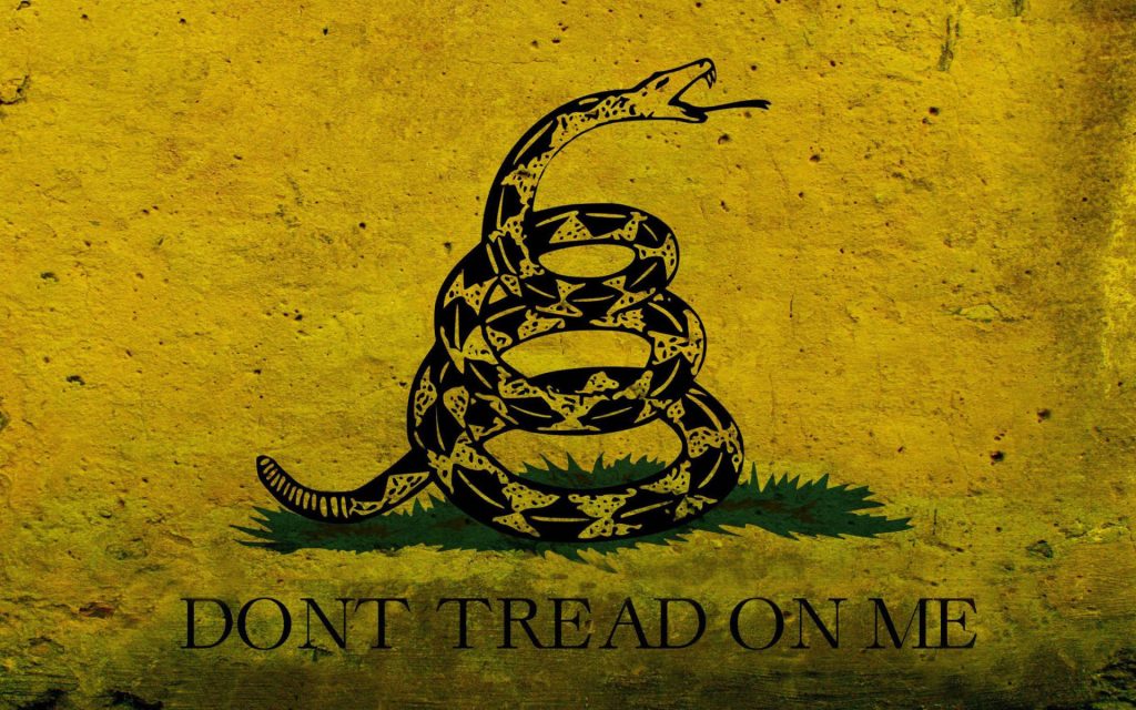 Gadsden flag wallpaper with coiled rattlesnake and Dont Tread On Me motto on distressed yellow
