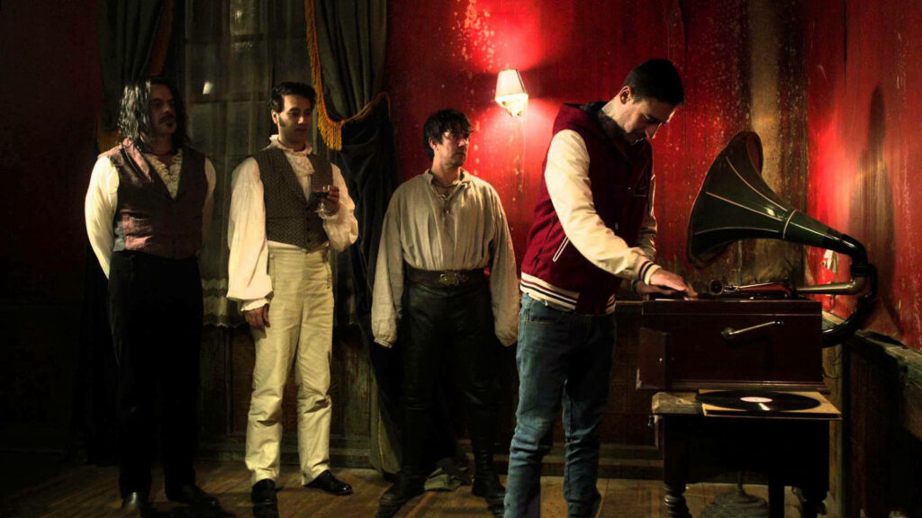 Vintage Gramophone in Dim Room: What We Do In The Shadows Scene Wallpaper
