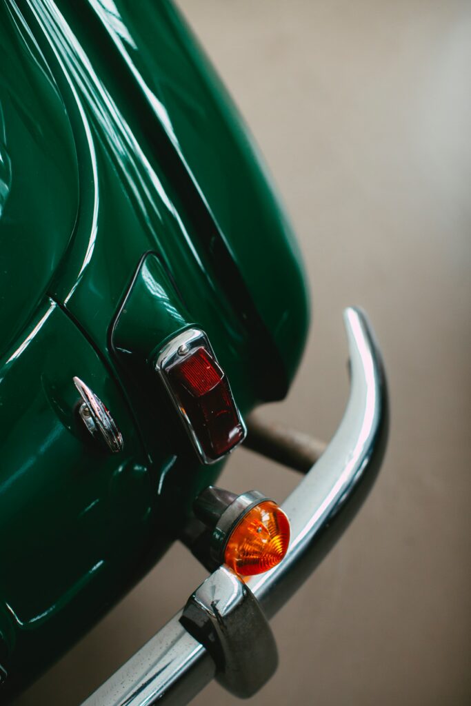 Vintage Green Car Wallpaper: Retro Design & Chrome Accents