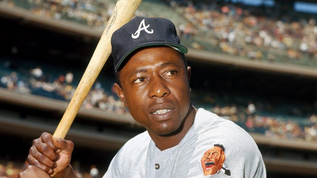 Hank Aaron vintage MLB portrait in Braves uniform holding bat at plate stadium background wallpaper