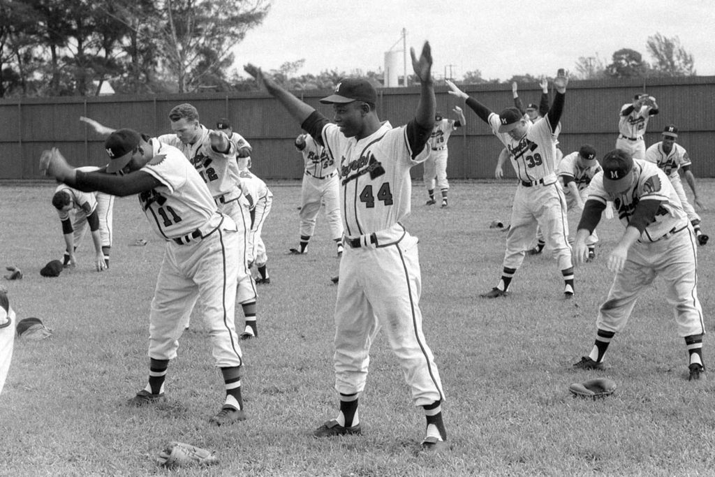 Vintage black and white photo of Hank Aaron Milwaukee Braves stretching during spring training Wallpaper