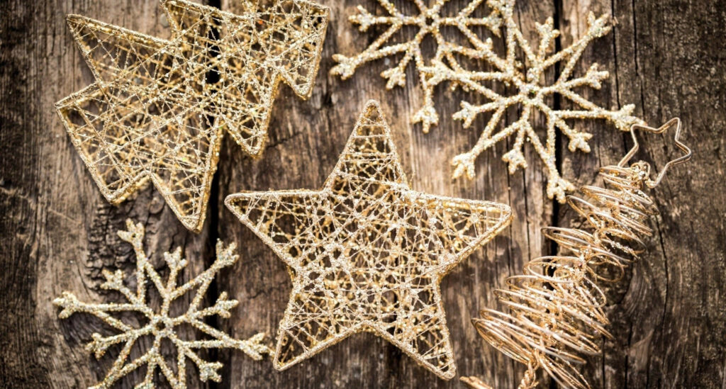 Vintage Holiday Wallpaper: Golden Decor & Rustic Wooden Background