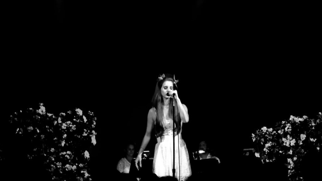 Vintage Lana Del Rey Wallpaper: Floral Stage Performance Art