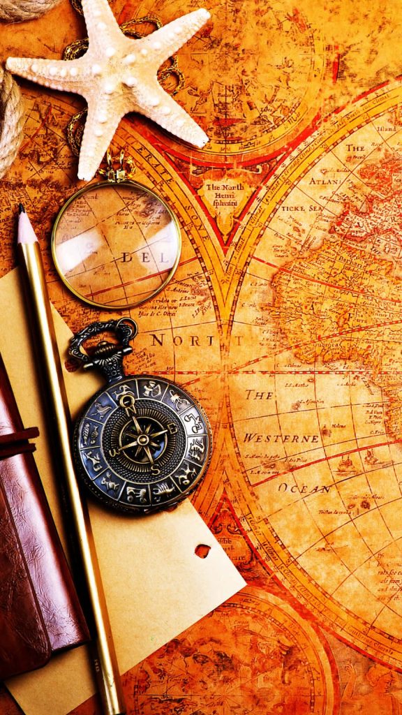 Vintage map wallpaper with starfish compass magnifying glass pencil travel aesthetic flat lay