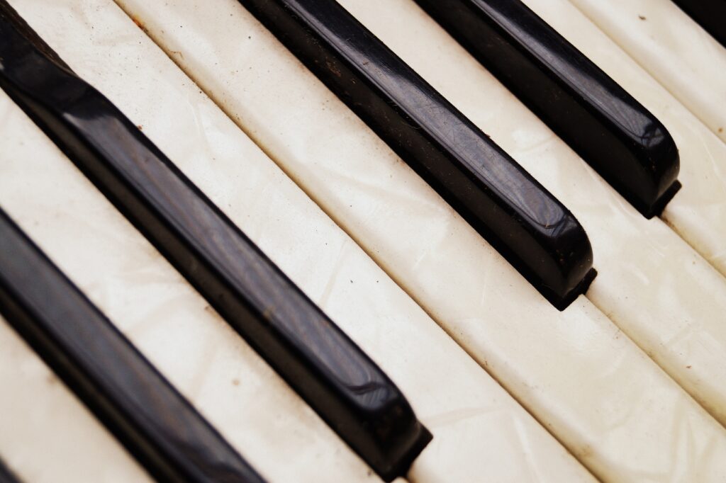 Vintage Musical Keys Wallpaper: Textured Accordion & Piano Detail